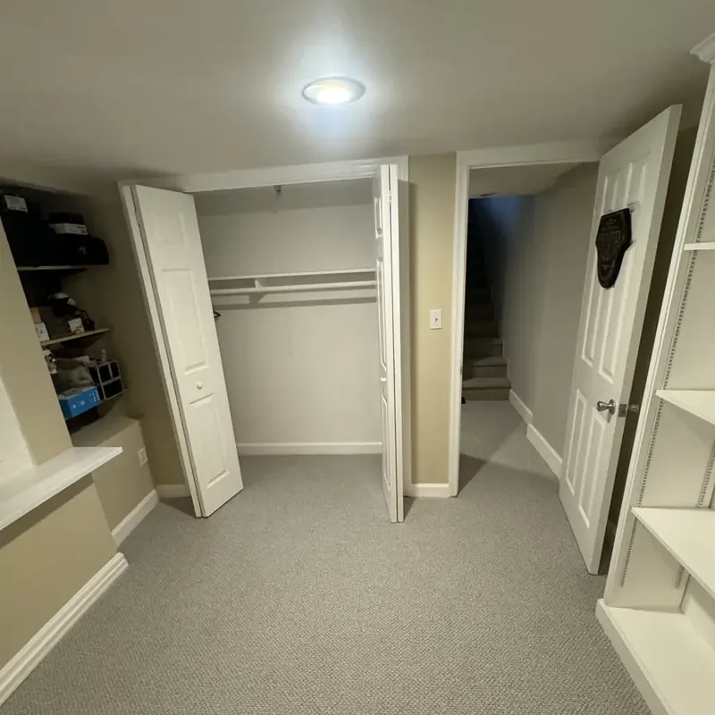Basement closet doors with stairs visible