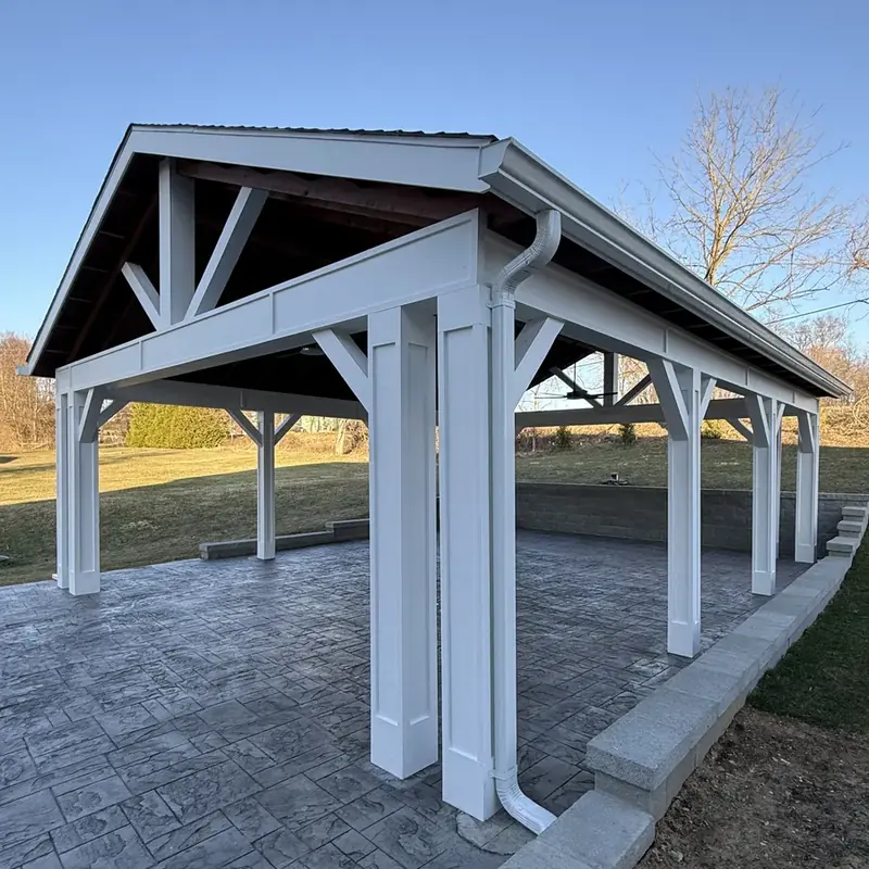 Side view of large white pavilion over patio