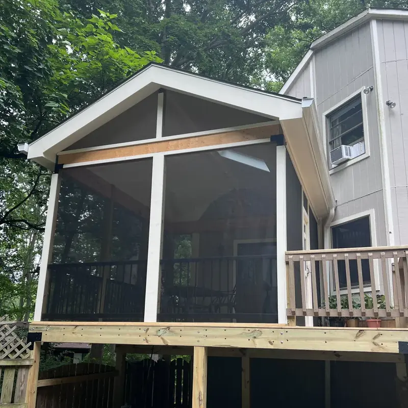 Two-story screened porch addition on gray house