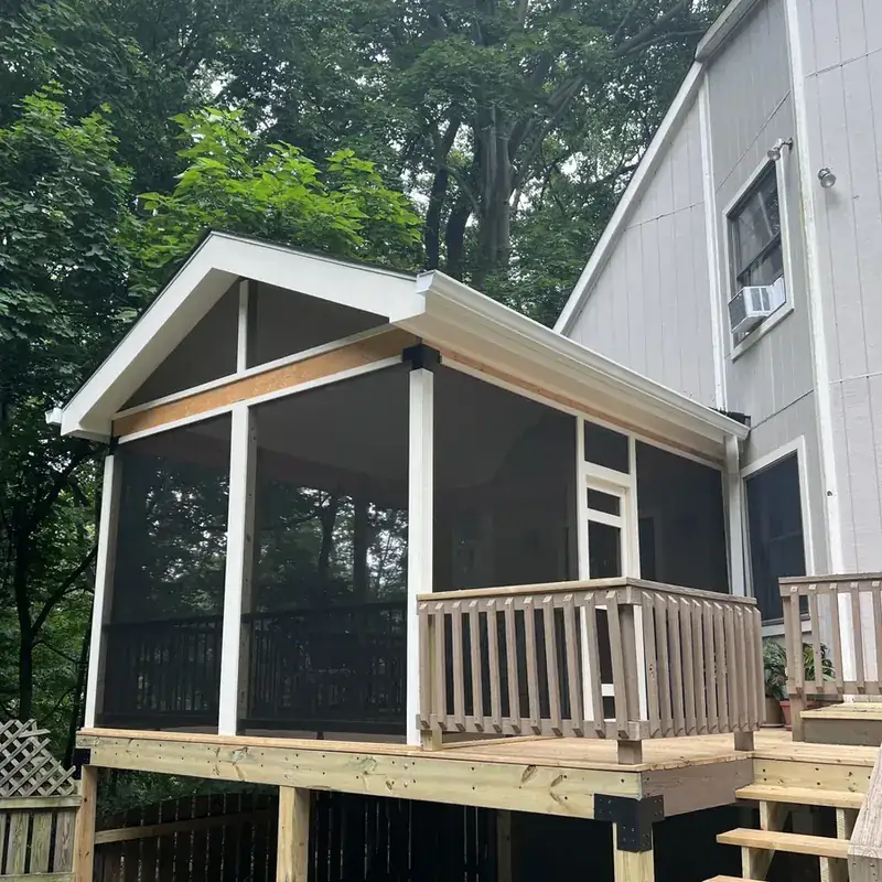 Screened porch addition with wood deck and railings