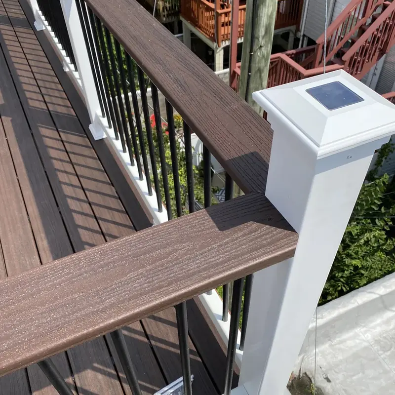 close-up of composite deck railing with solar post cap