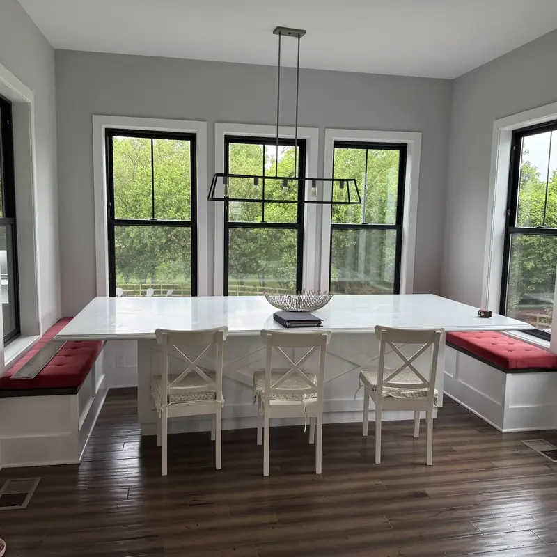 breakfast nook with banquette seating and pendant light