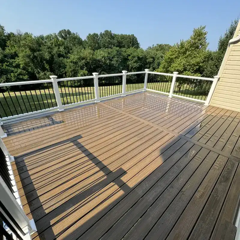Composite deck with black and white cable railing