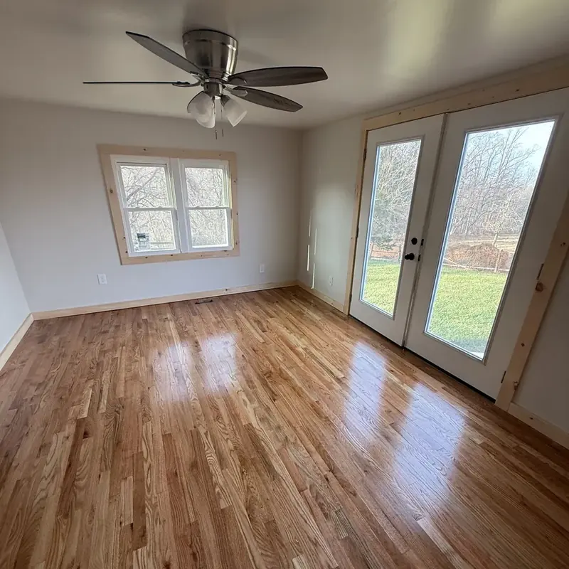 empty room with double french doors and window