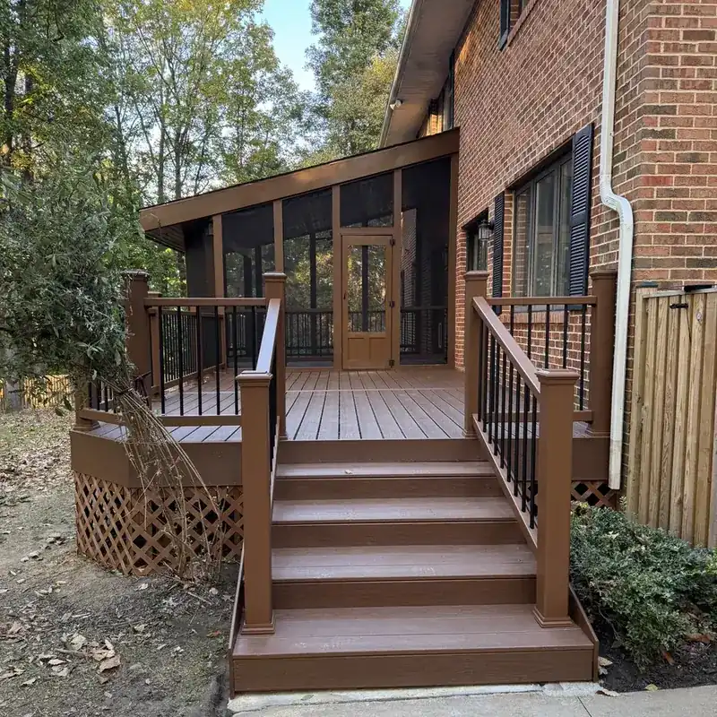 brown composite deck with stairs and screened porch