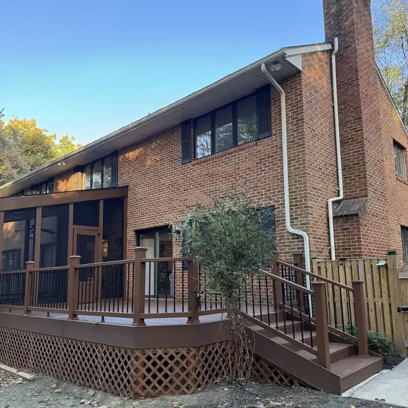 brick house exterior with composite deck and railings