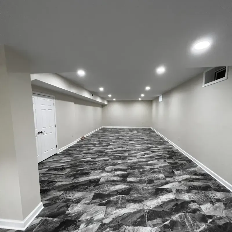 finished basement with marbled vinyl tile flooring