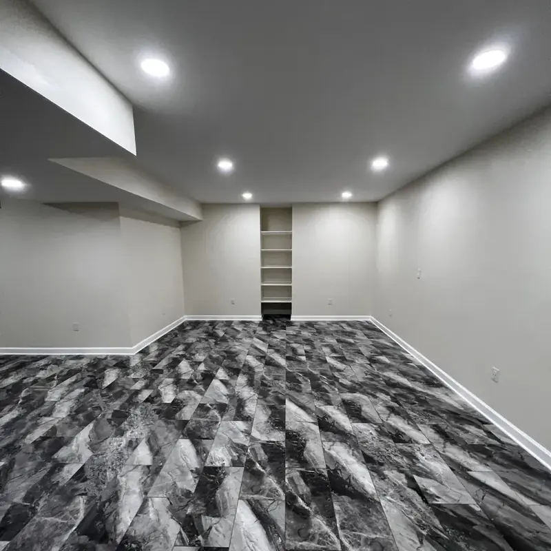 finished basement with built-in shelving niche