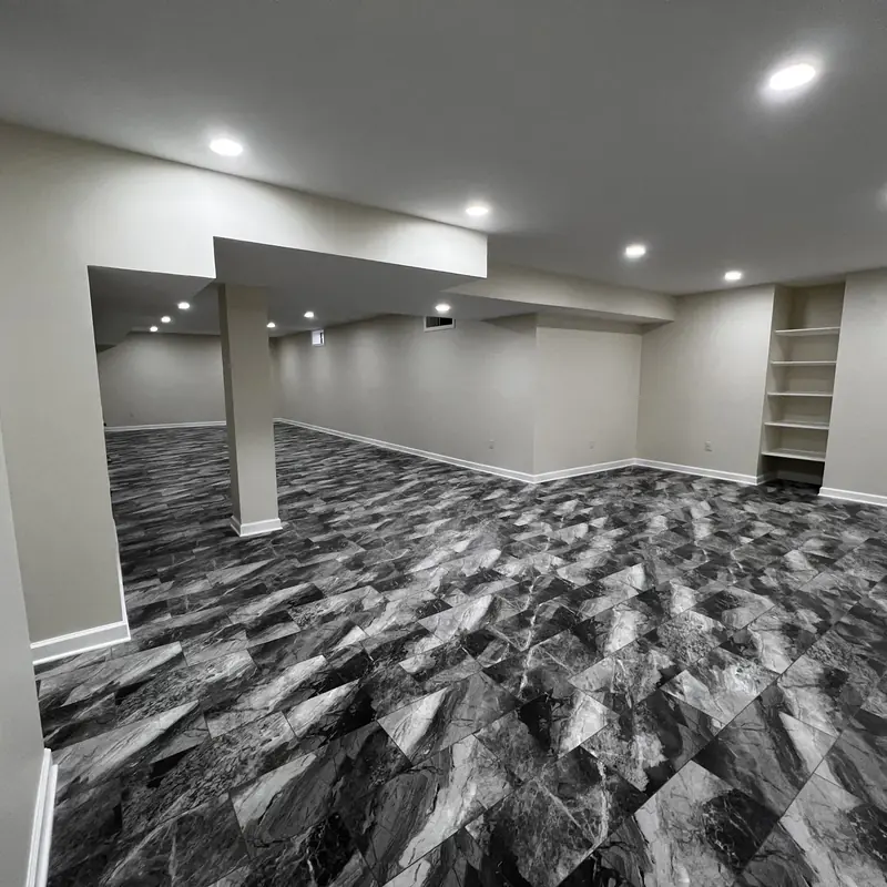 finished basement with column and shelving niche