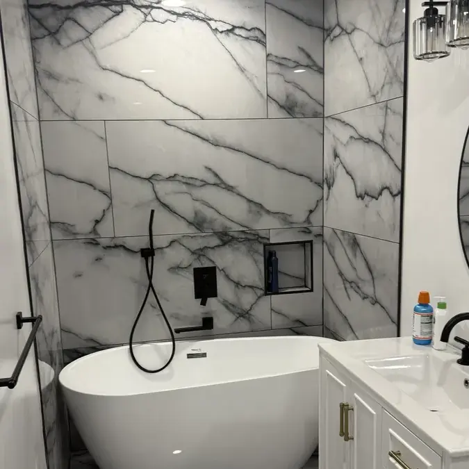 Freestanding tub with marble walls and white vanity