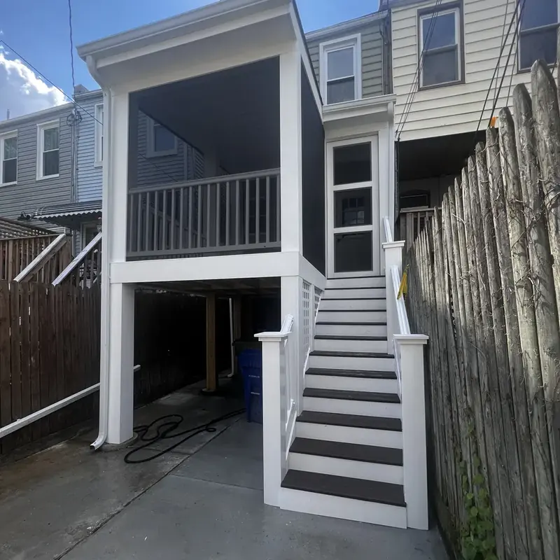Side view of raised deck with white staircase