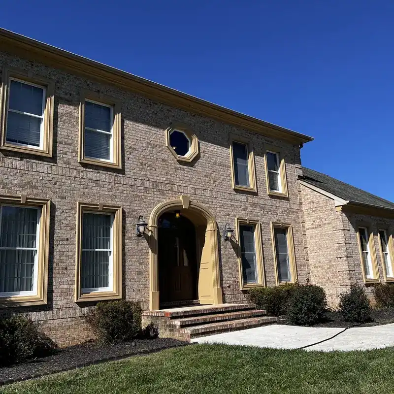 Two-story brick home front facade with windows